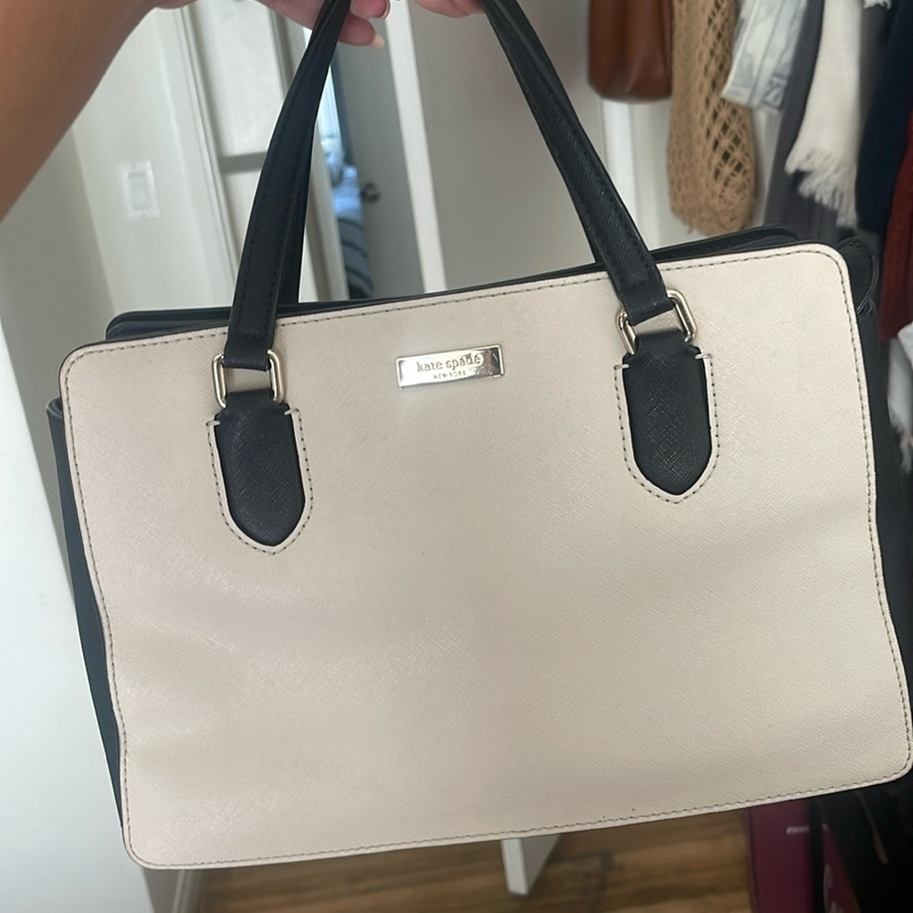 Kate Spade. Black and cream purse with cross bag handle.